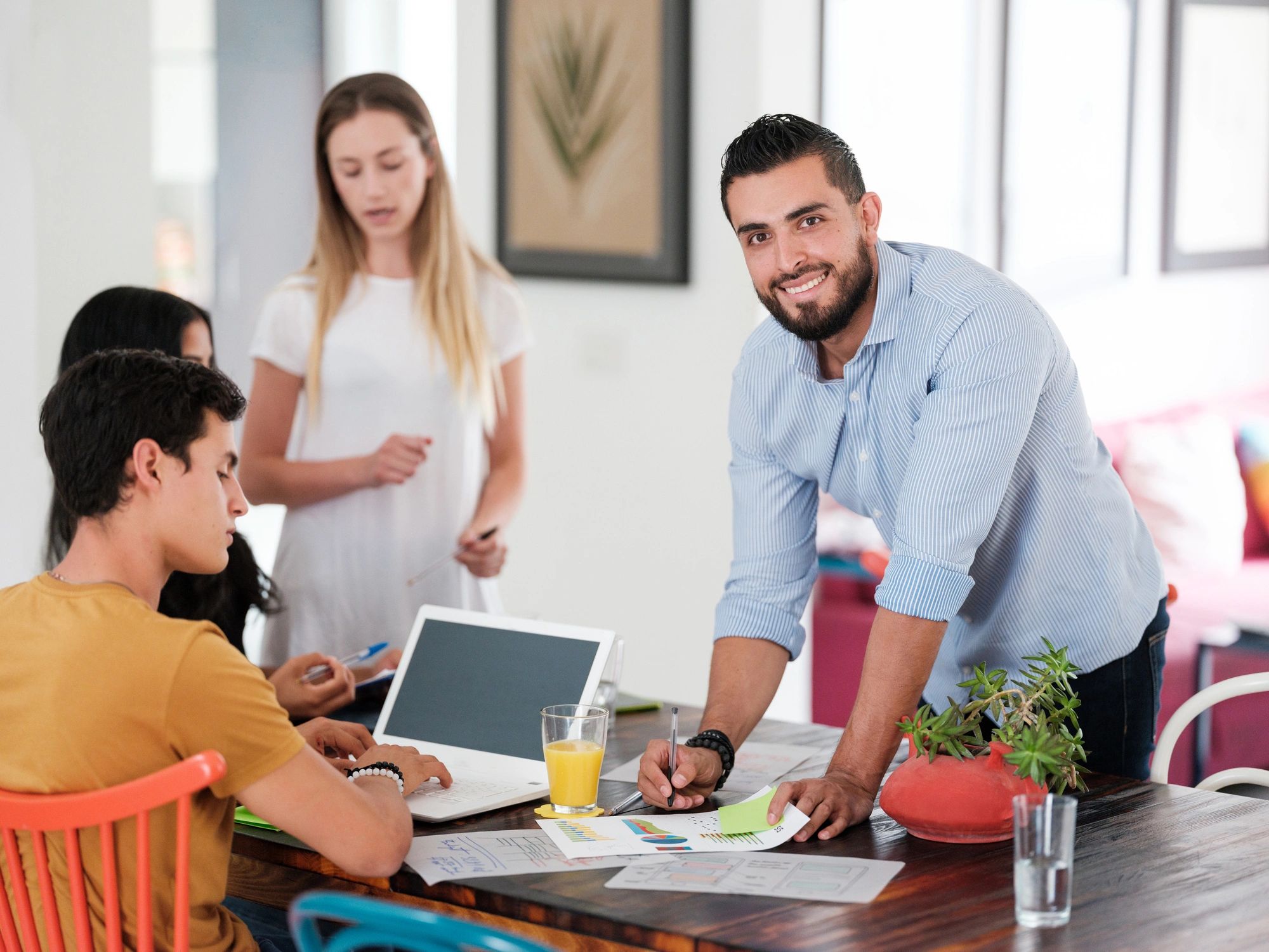 Business professional collaborating with a creative team